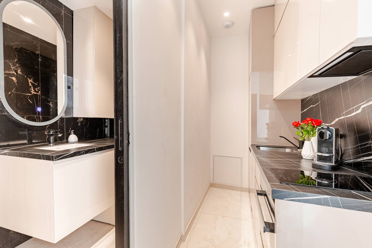 Bathroom washbasin, opening onto the kitchen
